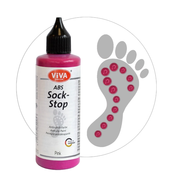 Viva Decor ABS Sock-Stop antislip-verf in de kleur pink, flesje met puntdop, naast een voetafdruk met roze antislip-stippen op de zool